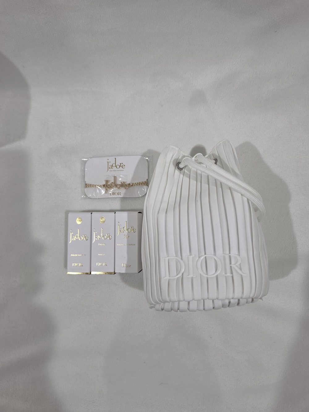 DIOR White Pleated Bucket Bag & Elegant J'adore Bracelet.